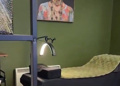 Relaxing treatment bed at LashesbyEmma in Manchester, England, GB, with modern decor and ambient lighting.