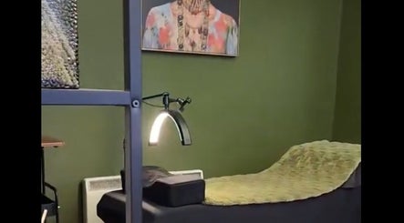 Relaxing treatment bed at LashesbyEmma in Manchester, England, GB, with modern decor and ambient lighting.