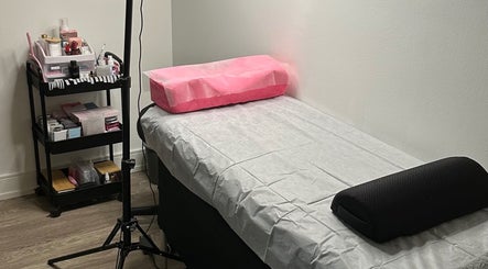 Comfortable treatment bed at Lash&Brow Glow in Toronto, Ontario, CA, ready for beauty services.