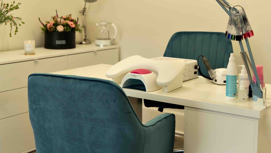 Cozy nail station at Kateryna Nails, Birmingham, England, GB, featuring plush seating and modern nail care tools.