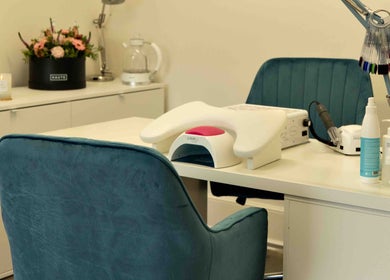 Cozy nail station at Kateryna Nails, Birmingham, England, GB, featuring plush seating and modern nail care tools.