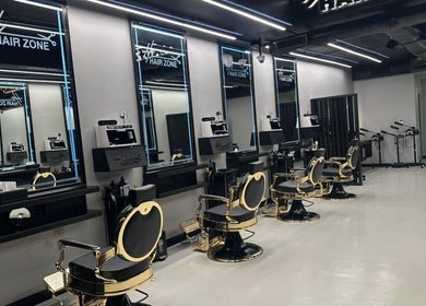 Elegant interior of Hair Zone - An Narjis, Riyadh, showcasing stylish salon chairs and modern decor.