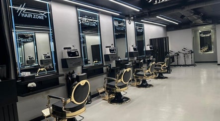 Elegant interior of Hair Zone - An Narjis, Riyadh, showcasing stylish salon chairs and modern decor.