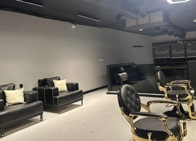 Spacious interior of Hair Zone - An Narjis in Riyadh, Riyadh Province, SA featuring elegant salon chairs and sofas.