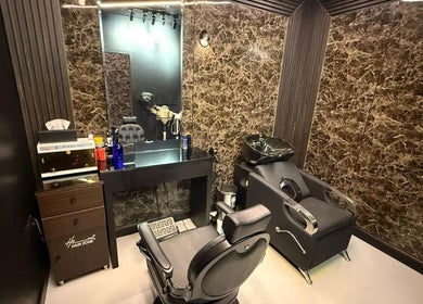Elegant salon interior at Hair Zone - Al Yasmin, Riyadh, Riyadh Province, SA featuring modern styling chair.