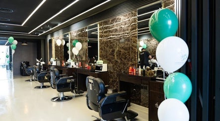 Modern styling chairs at Hair Zone - Al Yasmin, Riyadh, Riyadh Province, SA with elegant mirrors and balloons.
