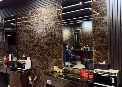 Luxurious interior of Hair Zone - Al Yasmin in Riyadh, Riyadh Province, SA with marble design and modern tools.