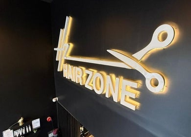 Illuminated Hair Zone - Al Yasmin sign in Riyadh, Riyadh Province, SA, showcasing elegance.