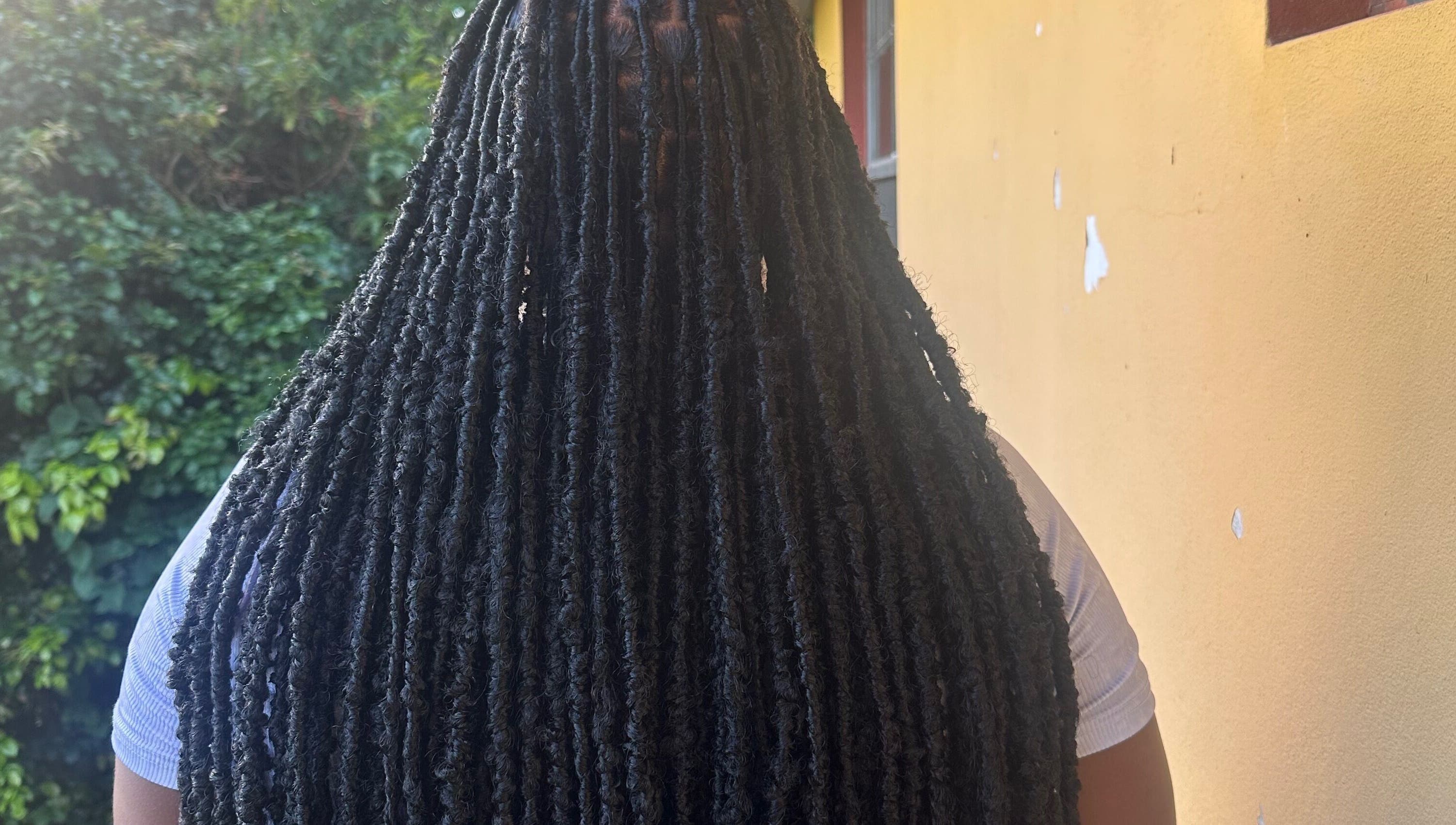 Close-up of long faux locs hairstyle at fauxlocs.by.niahh, Arnos Vale, St. George, VC.