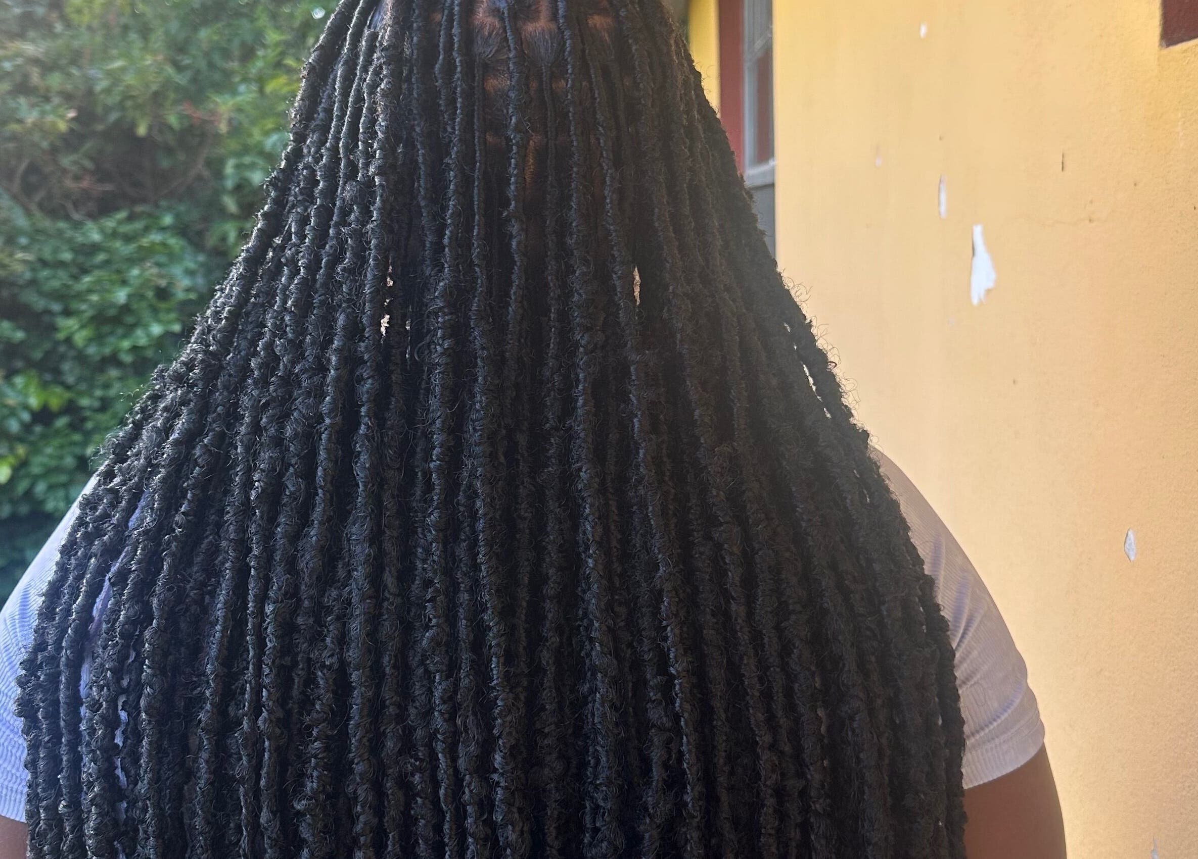 Close-up of long faux locs hairstyle at fauxlocs.by.niahh, Arnos Vale, St. George, VC.