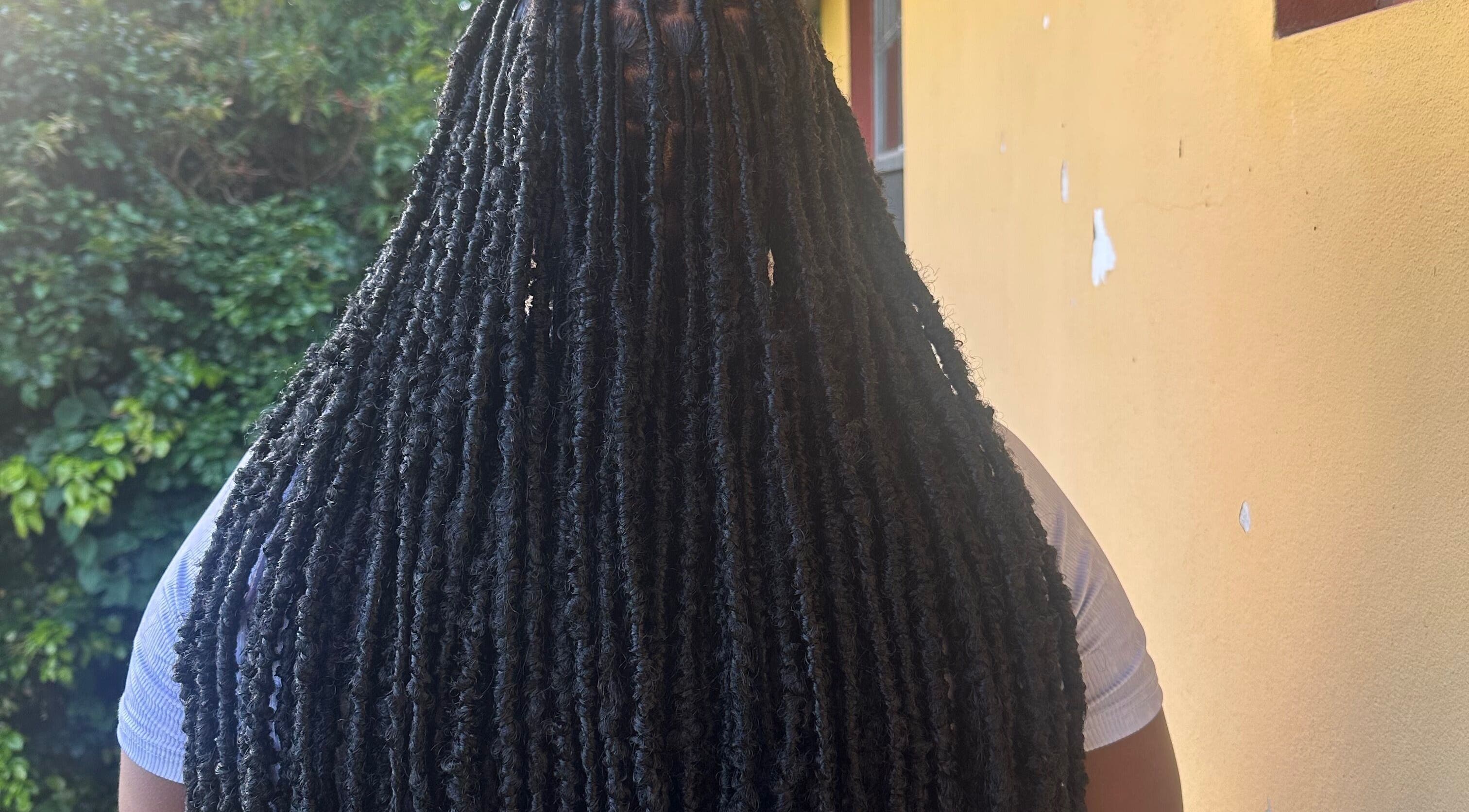 Close-up of long faux locs hairstyle at fauxlocs.by.niahh, Arnos Vale, St. George, VC.