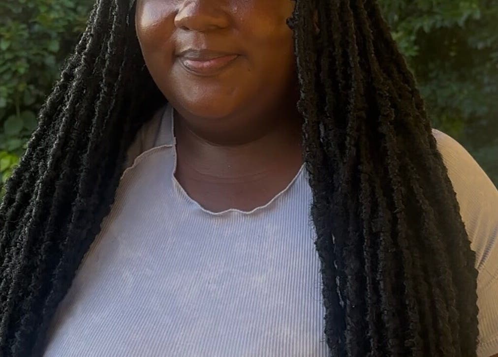 Woman with elegant faux locs hairstyle at fauxlocs.by.niahh in Arnos Vale, St. George, VC.