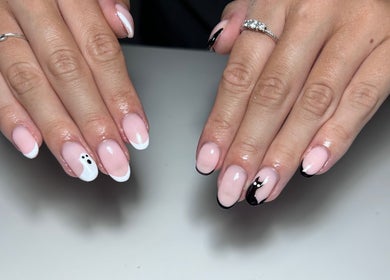 Elegant manicure with black and white nail art at T tips and toes, St Albans, England, GB.
