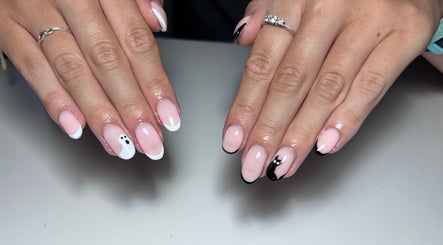 Elegant manicure with black and white nail art at T tips and toes, St Albans, England, GB.