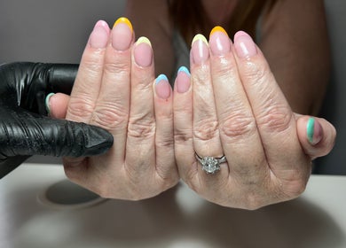 Colorful nail art at T tips and toes, St Albans, England, GB, showcasing a vibrant manicure.