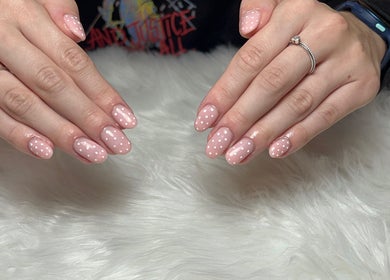 Elegant polka-dot nails at T tips and toes, St Albans, England, GB, showcasing expert nail design.