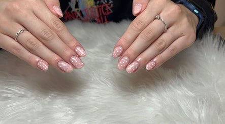 Elegant polka-dot nails at T tips and toes, St Albans, England, GB, showcasing expert nail design.