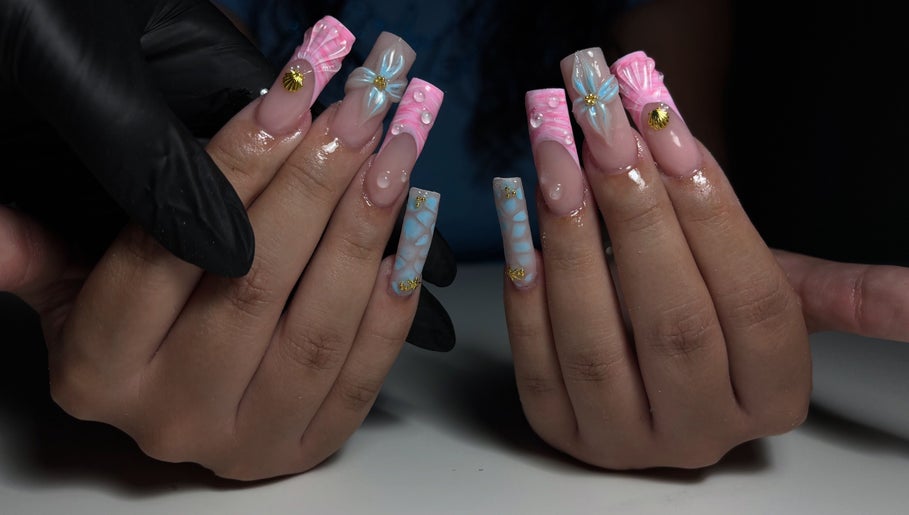 Intricate nail artistry at T Tips And Toes, St Albans, England, GB showcasing elegant, colorful designs.