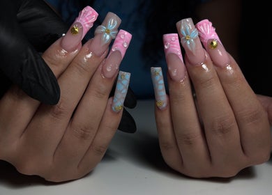 Intricate nail artistry at T Tips And Toes, St Albans, England, GB showcasing elegant, colorful designs.
