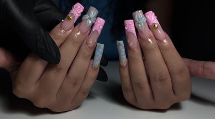 Intricate nail artistry at T Tips And Toes, St Albans, England, GB showcasing elegant, colorful designs.