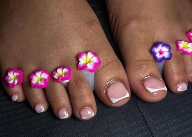 Floral-themed pedicure at T Tips And Toes, St Albans, England, GB showcasing nail art elegance.