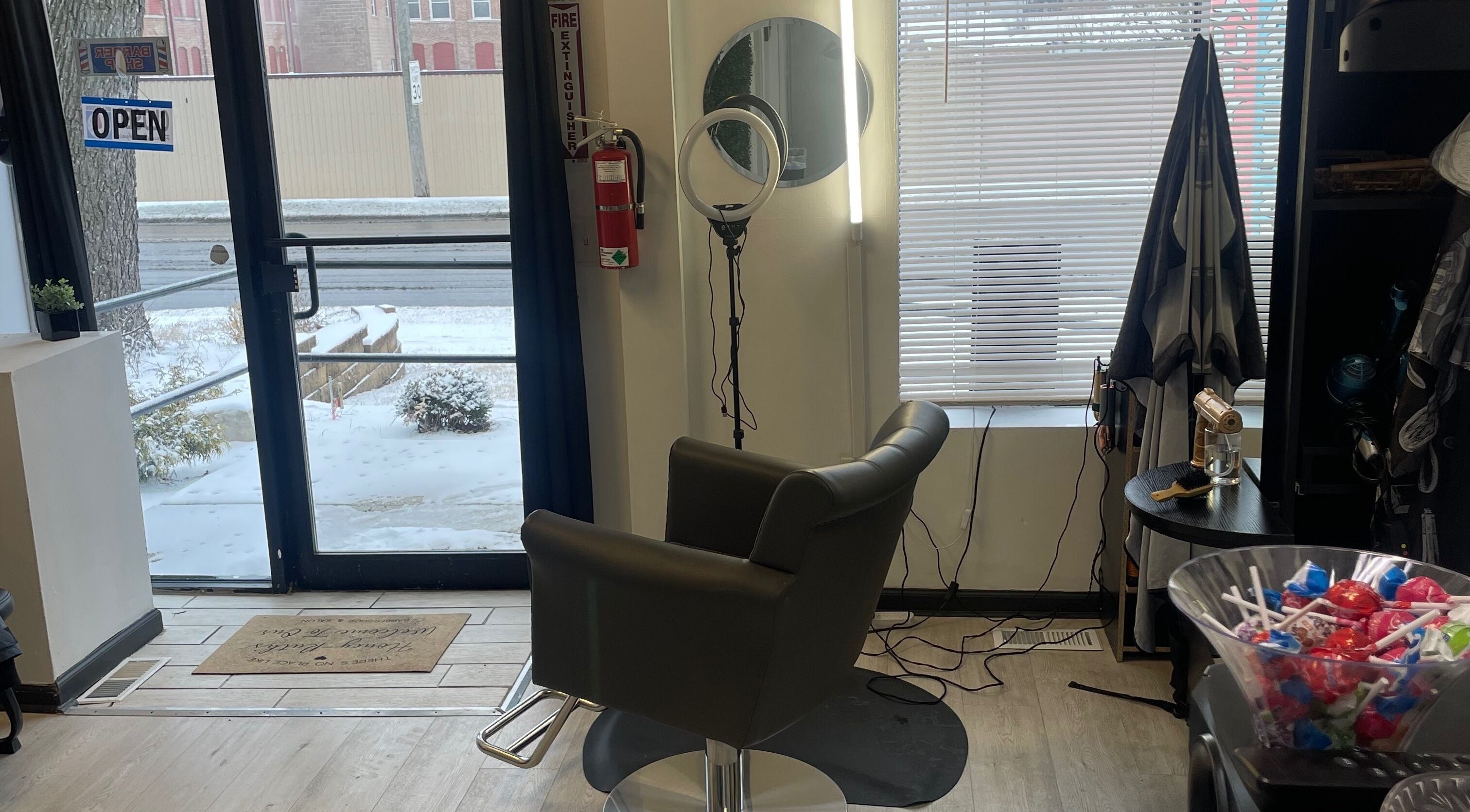 Savage Kutz salon's stylish chair near entrance in Aurora, Illinois, US, with vibrant decor.