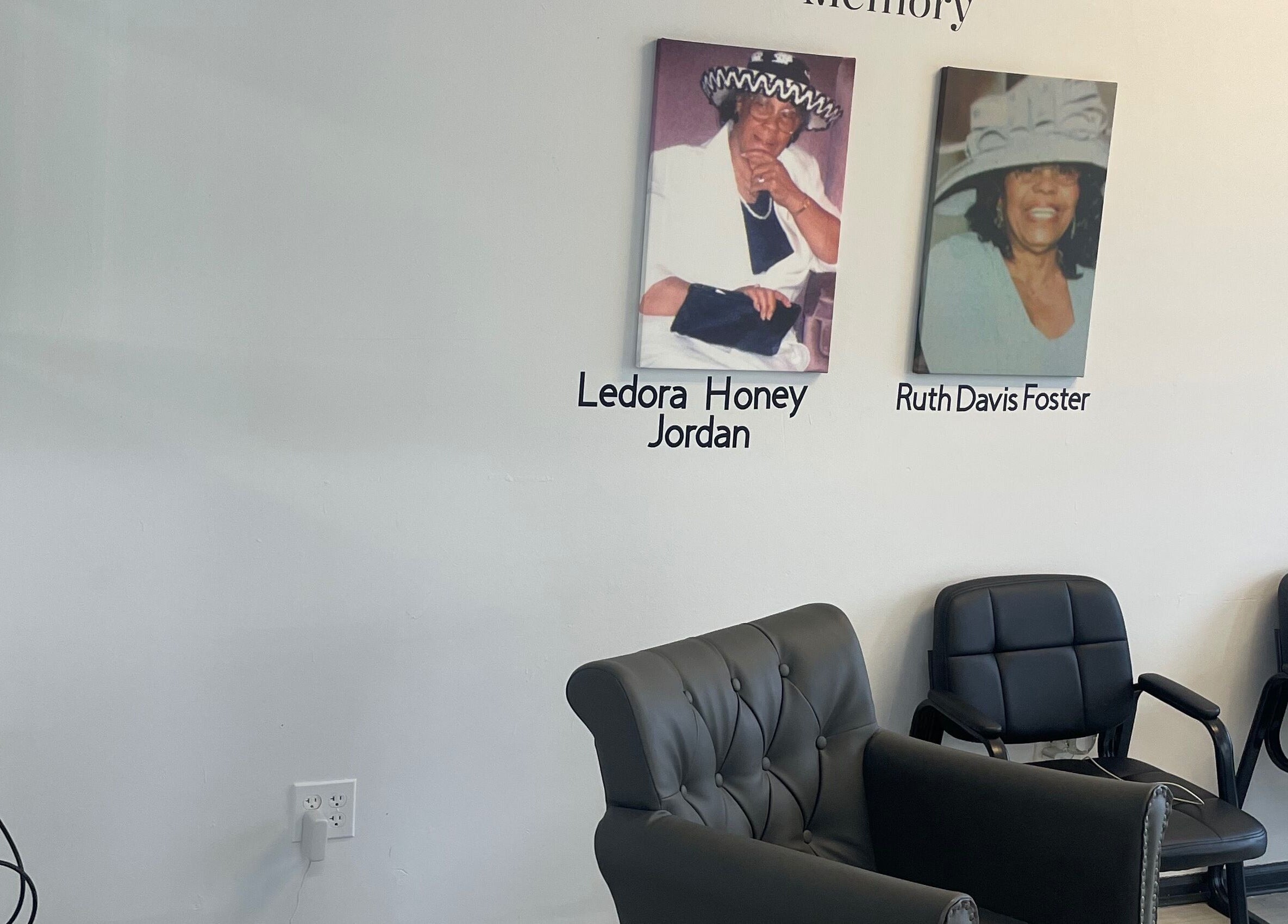 Memorial wall with armchairs at Savage Kutz, Aurora, Illinois, US honoring Ledora Honey Jordan and Ruth Davis Foster.