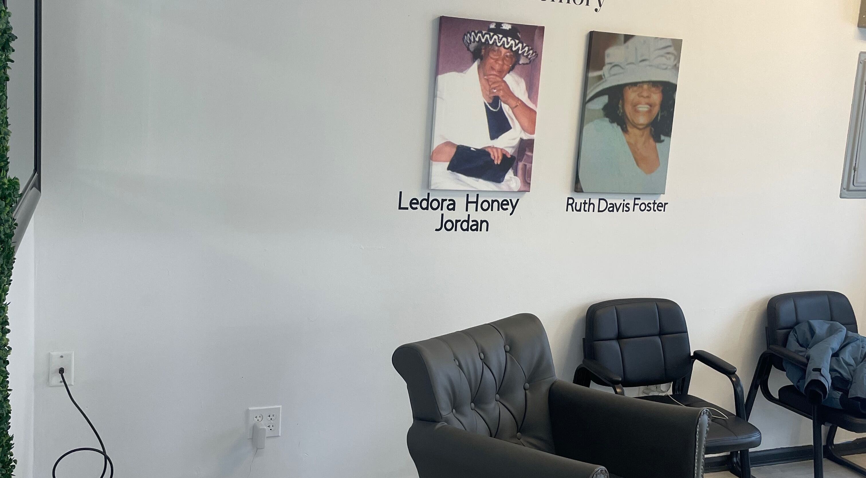 Memorial wall with armchairs at Savage Kutz, Aurora, Illinois, US honoring Ledora Honey Jordan and Ruth Davis Foster.