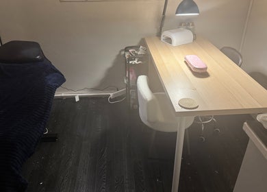 Cozy treatment room at Beauty by Shannon in Bristol, England, GB, featuring a stylish table and chair setup.
