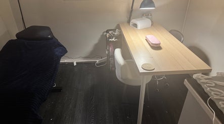 Cozy treatment room at Beauty by Shannon in Bristol, England, GB, featuring a stylish table and chair setup.