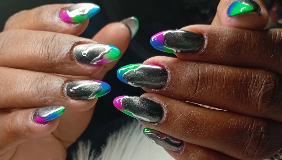 Colorful nail art design at Cialeyah Beauty Bar, Philipsburg, SX, featuring vivid shades.
