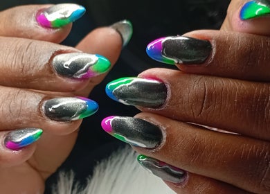 Colorful nail art design at Cialeyah Beauty Bar, Philipsburg, SX, featuring vivid shades.