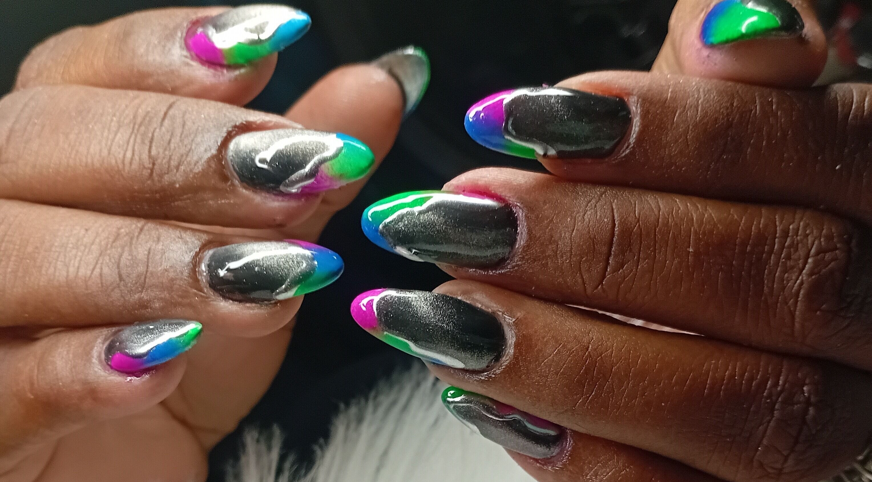Colorful nail art design at Cialeyah Beauty Bar, Philipsburg, SX, featuring vivid shades.