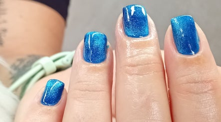 Vibrant blue glitter nails at Cialeyah Beauty Bar, Philipsburg, SX, showcasing expert nail artistry.