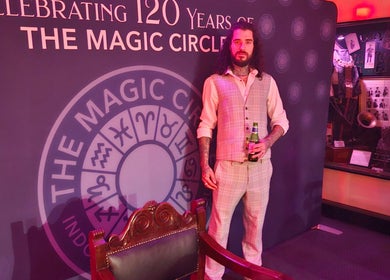 Person in vintage suit at The Magic Circle, celebrating 120 years in Stratford Upon Avon, GB at Slick Magic.