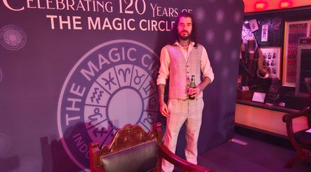 Person in vintage suit at The Magic Circle, celebrating 120 years in Stratford Upon Avon, GB at Slick Magic.