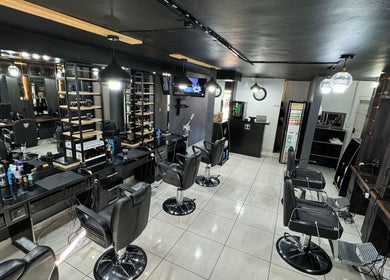 Sleek interior of Hairsurgery Lifestyle in Bloemfontein, Free State, ZA, showcasing modern salon stations.
