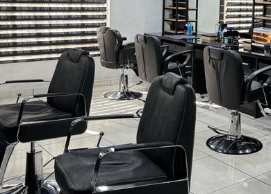 Elegant salon chairs at Hairsurgery Lifestyle, Bloemfontein, Free State, ZA, showcasing a modern interior.