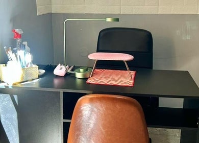 Cozy nail station setup at Siara K Nails in Paramaribo, Paramaribo, SR with tools and ergonomic chair.