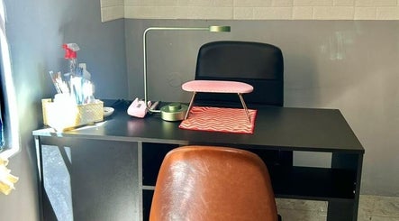 Cozy nail station setup at Siara K Nails in Paramaribo, Paramaribo, SR with tools and ergonomic chair.