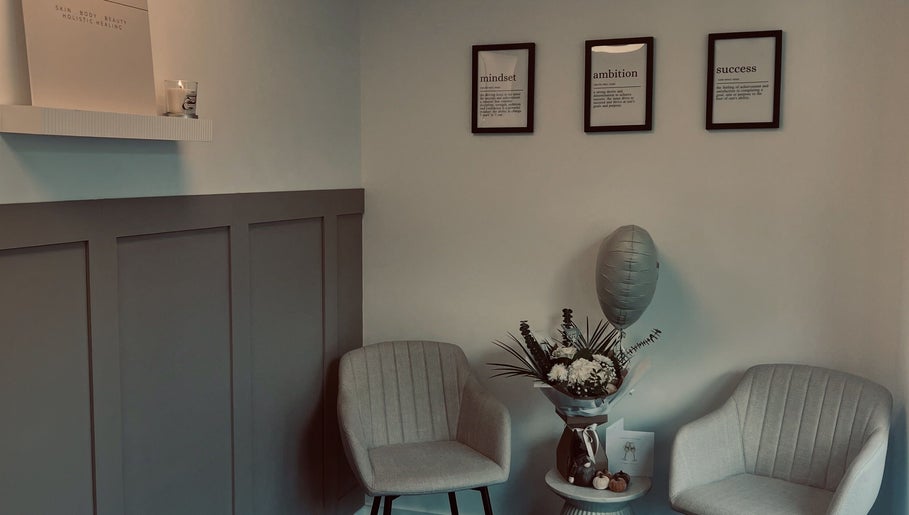Inviting lounge at Skin Collective, Mossley, England, GB with elegant chairs and decor.