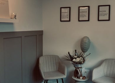Inviting lounge at Skin Collective, Mossley, England, GB with elegant chairs and decor.