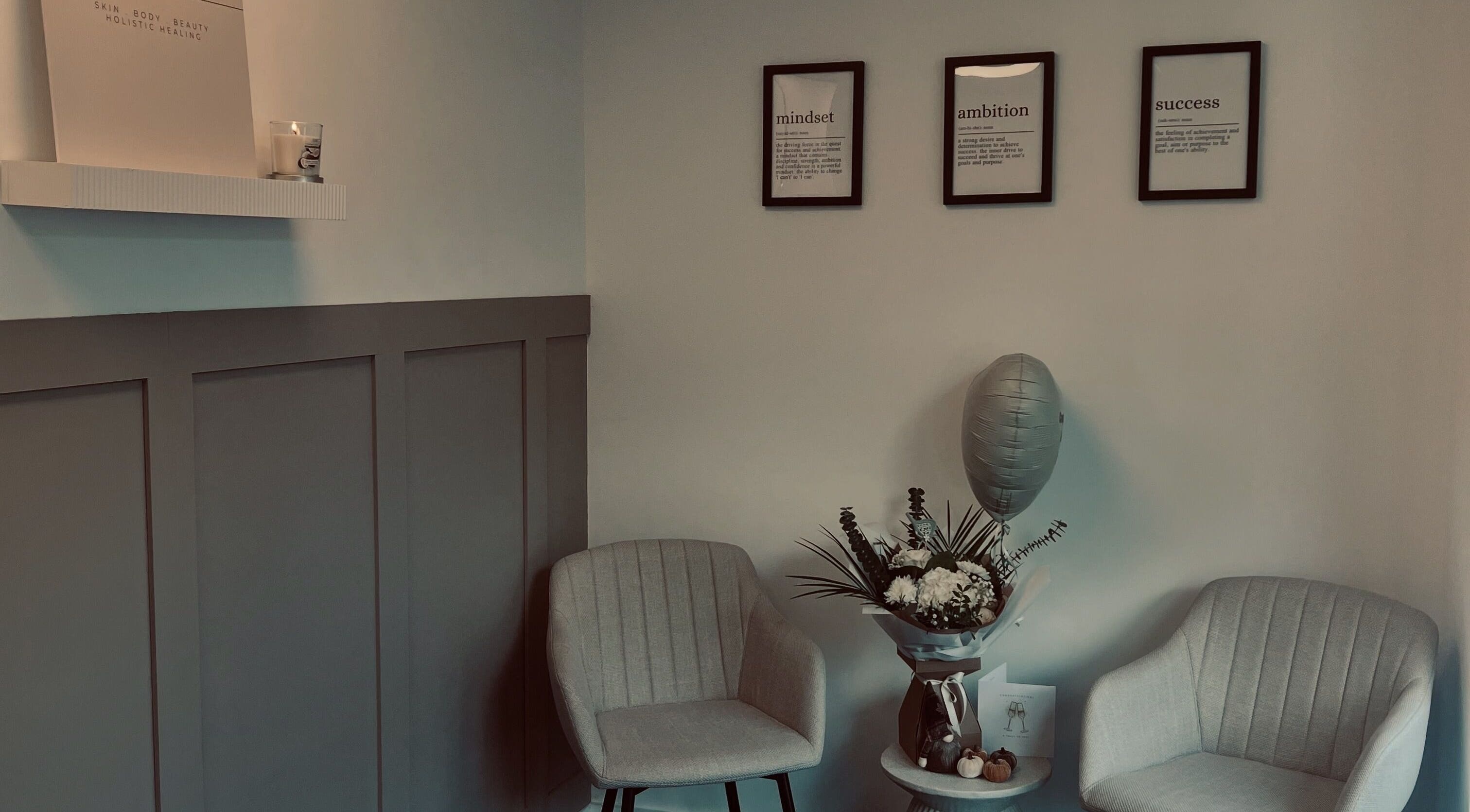 Inviting lounge at Skin Collective, Mossley, England, GB with elegant chairs and decor.