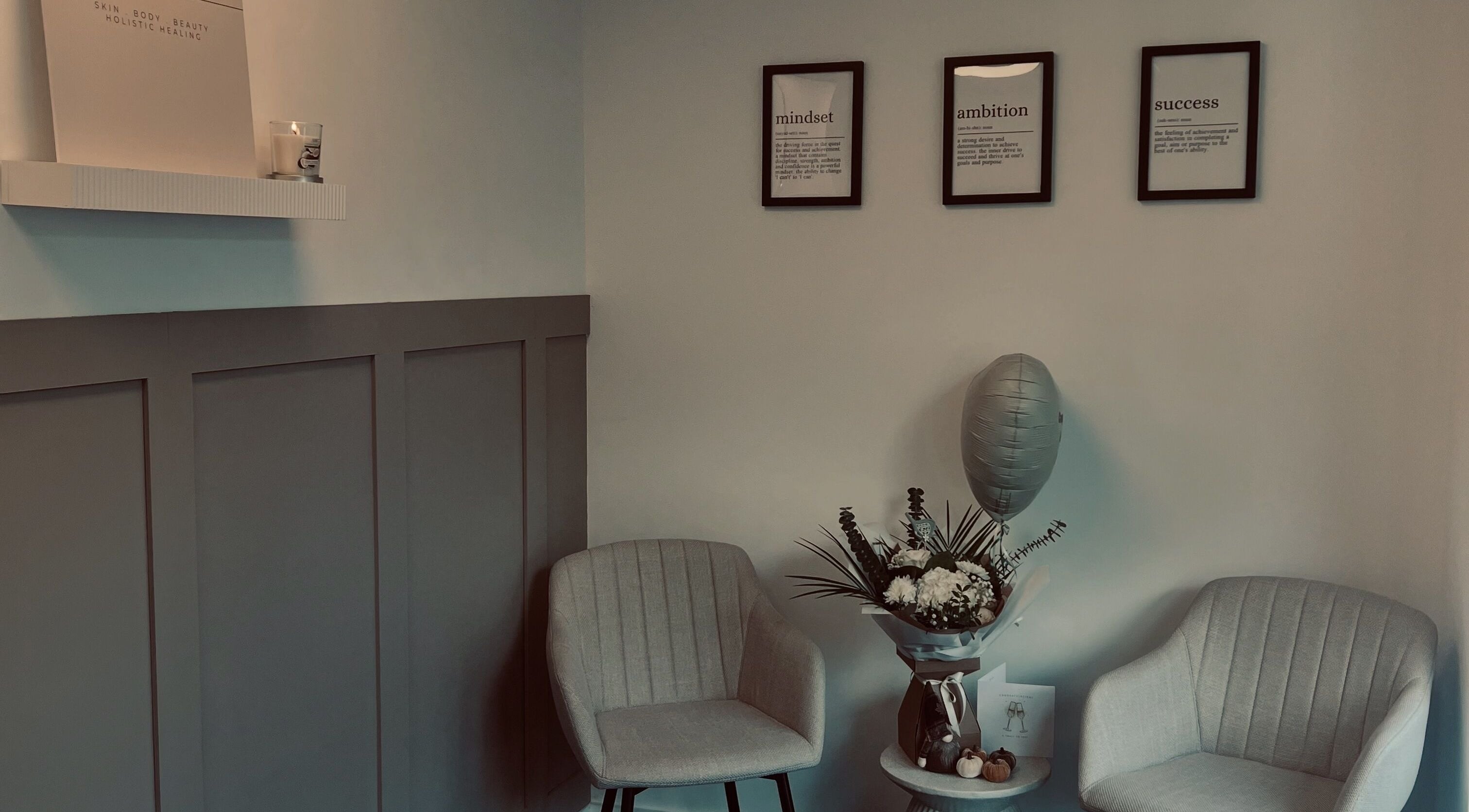 Inviting lounge at Skin Collective, Mossley, England, GB with elegant chairs and decor.