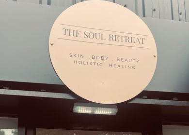 Entrance sign of Skin Collective in Mossley, England, GB, showcasing holistic beauty and wellness offerings.