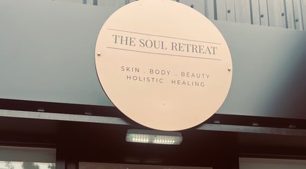 Entrance sign of Skin Collective in Mossley, England, GB, showcasing holistic beauty and wellness offerings.