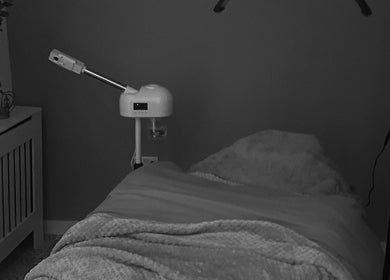 Relaxing treatment room at Skin Collective, Mossley, England, GB with cozy blanket and modern equipment.