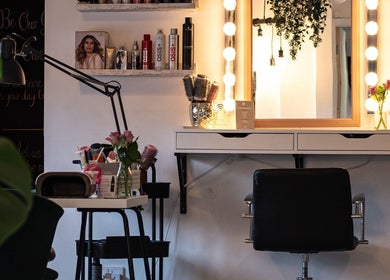 Elegant beauty station at Posh Nail and Beauty, Aston-on-trent, England, GB with glam lighting and styling tools.