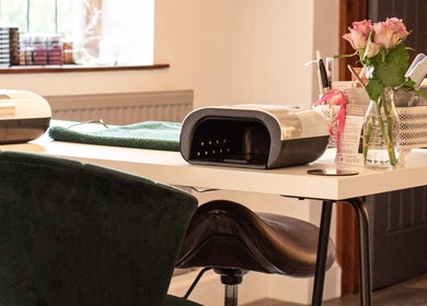 Nail station setup at Posh Nail and Beauty in Aston-on-trent, England, GB featuring elegant decor and equipment.