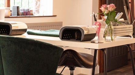 Nail station setup at Posh Nail and Beauty in Aston-on-trent, England, GB featuring elegant decor and equipment.